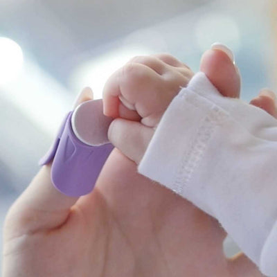 Baby Nails nail files are attached to a wearable Thumble which is worn on the thumb