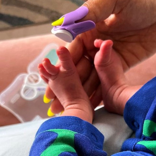 Filing baby's toes using Baby Nails baby nail filer